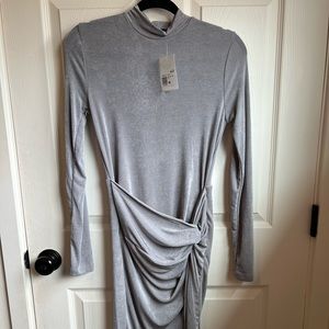 Grey knit dress with ruching and high slit
